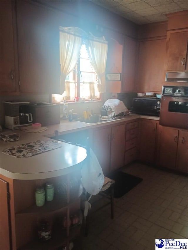 1815 Hampton Dr, Florence, SC 29505 - kitchen featuring black microwave, light countertops, and wall oven