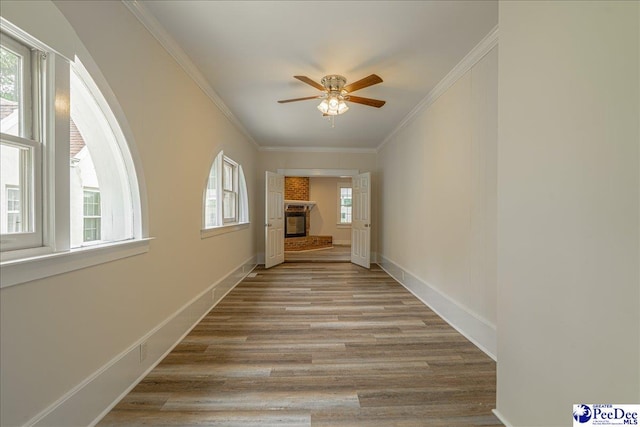 904 Madison Ave, Florence, SC 29501 - hall with healthy amount of natural light, ornamental molding, wood finished floors, and baseboards