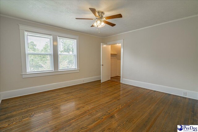 904 Madison Ave, Florence, SC 29501 - empty room with wood finished floors, ceiling fan, a textured ceiling, baseboards, and ornamental molding