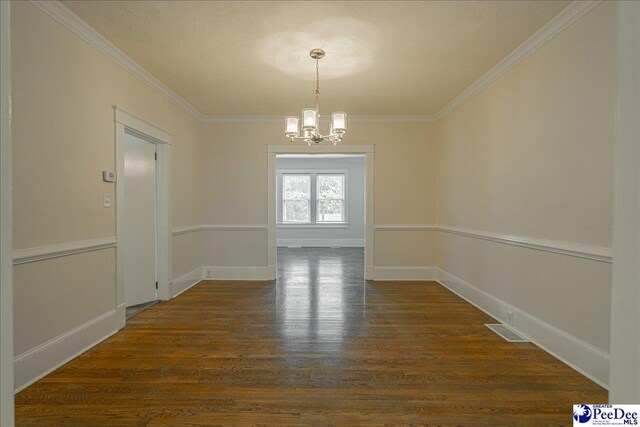 904 Madison Ave, Florence, SC 29501 - unfurnished dining area with a chandelier, crown molding, dark wood-style floors, and baseboards