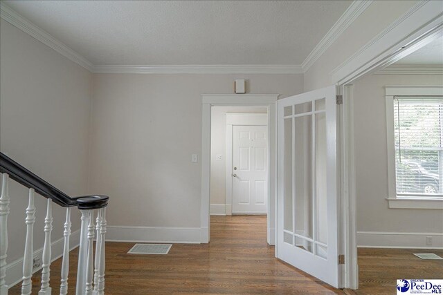 904 Madison Ave, Florence, SC 29501 - hallway with wood finished floors, ornamental molding, and baseboards