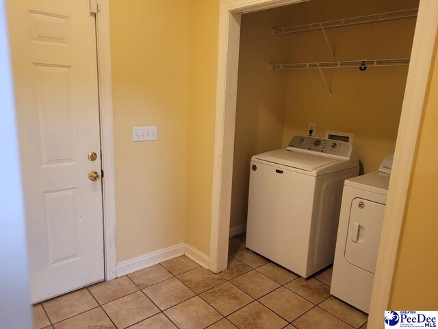 3675 W Pointe Dr, Florence, SC 29501 - washroom with washing machine and dryer and light tile patterned floors