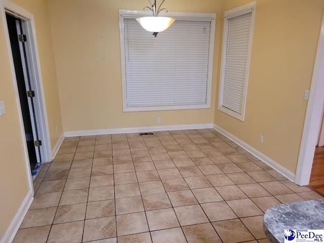 3675 W Pointe Dr, Florence, SC 29501 - unfurnished dining area with light tile patterned floors