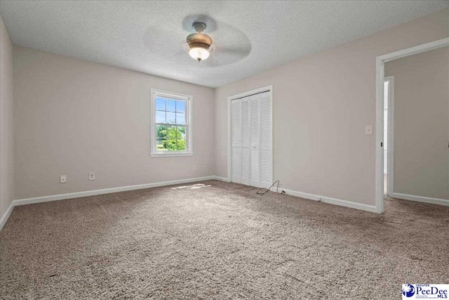 1526 Hunter St, Florence, SC 29505 - unfurnished bedroom with carpet floors, a closet, a textured ceiling, and ceiling fan