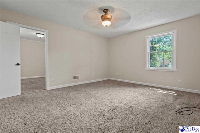 1526 Hunter St, Florence, SC 29505 - unfurnished room with carpet floors and a textured ceiling