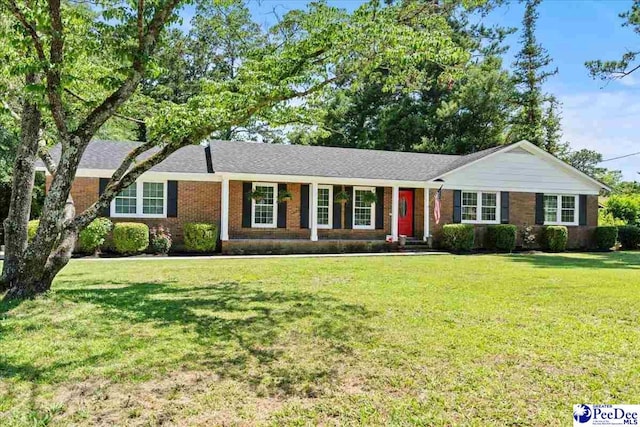 1526 Hunter St, Florence, SC 29505 - single story home with a front lawn and brick siding