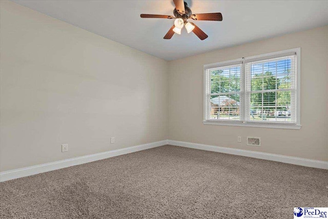 1526 Hunter St, Florence, SC 29505 - carpeted spare room featuring baseboards and a ceiling fan
