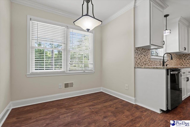 1526 Hunter St, Florence, SC 29505 - kitchen featuring dishwasher, crown molding, dark wood finished floors, pendant lighting, and decorative backsplash