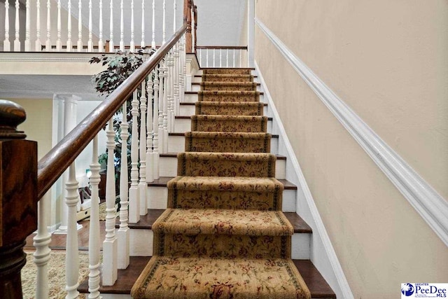 stairway with decorative columns