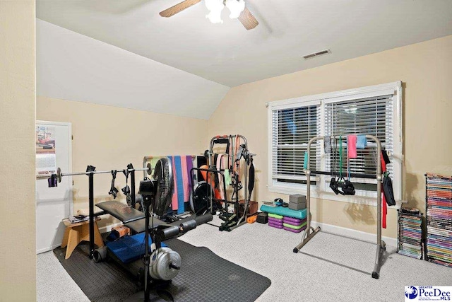 workout room featuring ceiling fan, vaulted ceiling, and carpet