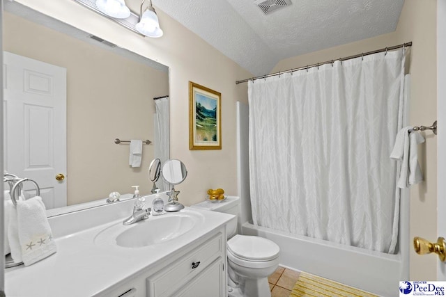 full bathroom featuring tile patterned floors, toilet, a textured ceiling, vanity, and shower / bathtub combination with curtain