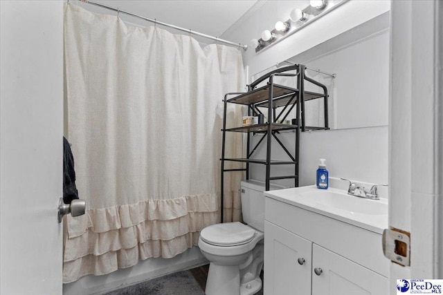 bathroom featuring shower / bath combination with curtain, vanity, and toilet