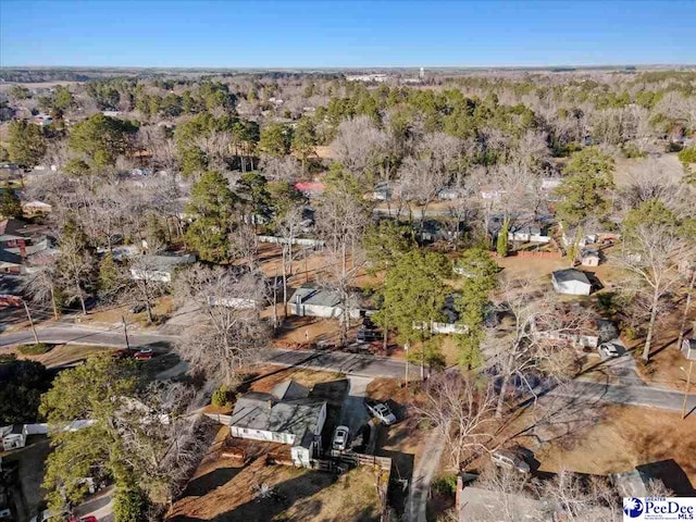 bird's eye view featuring a forest view