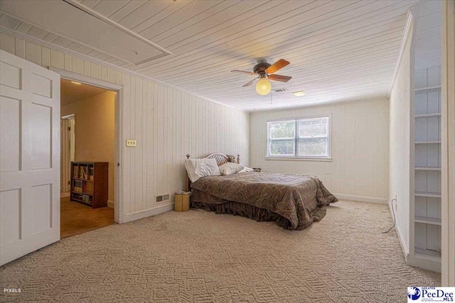 bedroom featuring wooden ceiling, ceiling fan, and carpet