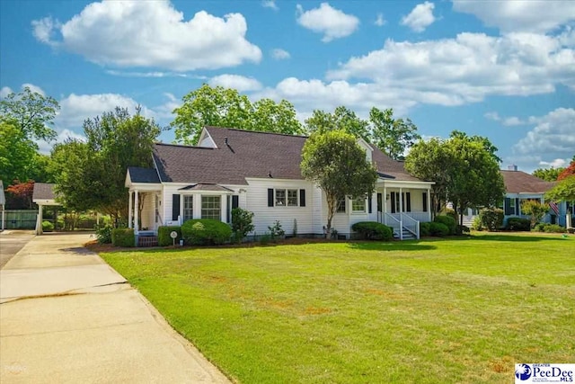 new england style home featuring a front lawn