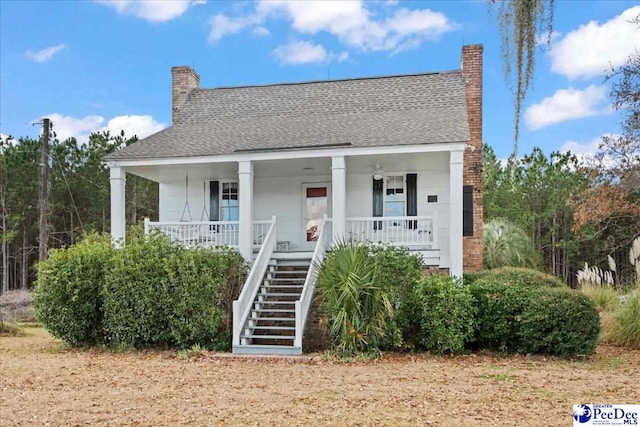 view of front of property featuring covered porch