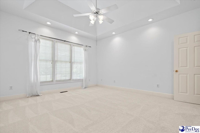 carpeted spare room with baseboards, a ceiling fan, and recessed lighting