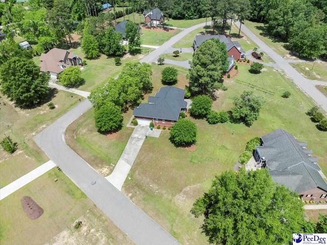 birds eye view of property with a residential view