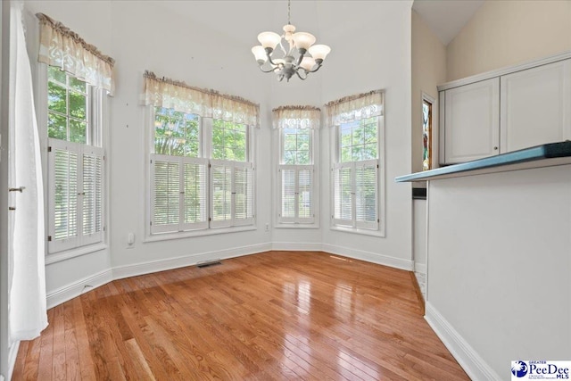 interior space with a notable chandelier and visible vents