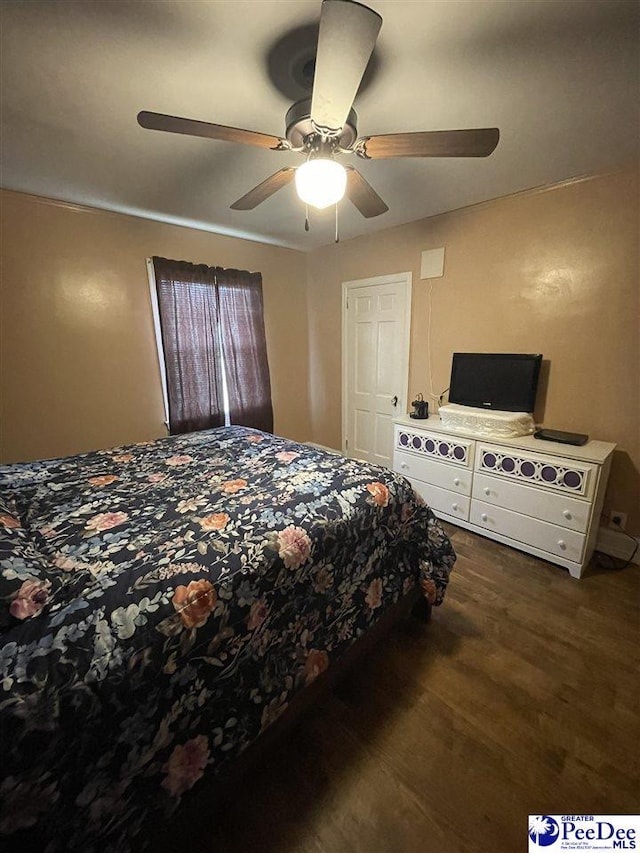 bedroom with dark wood-type flooring and ceiling fan