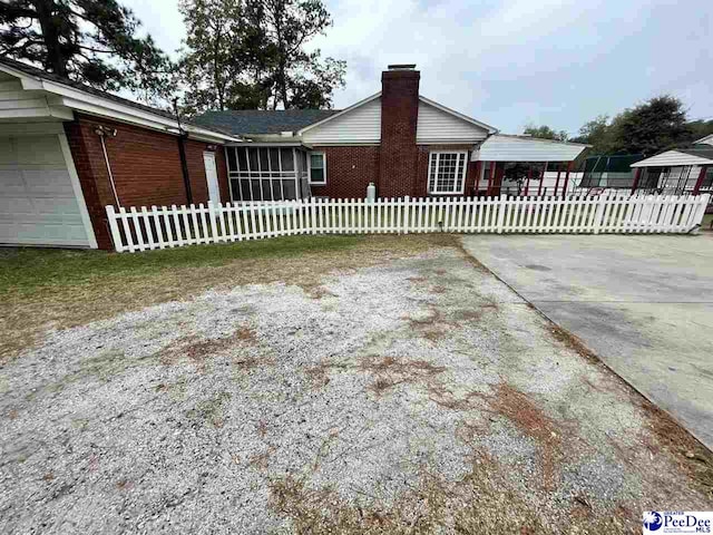 view of home's exterior with a carport