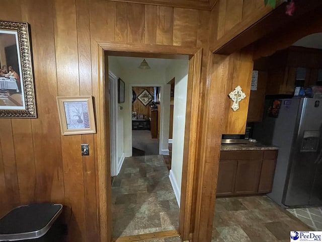 hallway with wooden walls