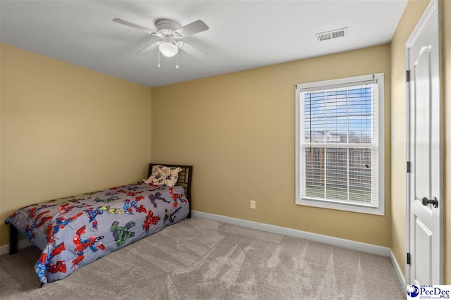 bedroom featuring light colored carpet and ceiling fan