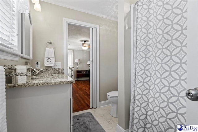 full bathroom with toilet, a shower with curtain, marble finish floor, crown molding, and vanity