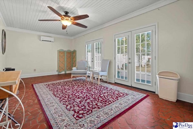 sitting room with ornamental molding, an AC wall unit, french doors, and baseboards