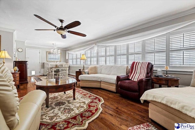 living area with ceiling fan with notable chandelier, wood finished floors, and crown molding