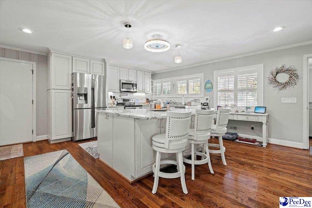 kitchen with ornamental molding, appliances with stainless steel finishes, dark wood-style flooring, and white cabinets