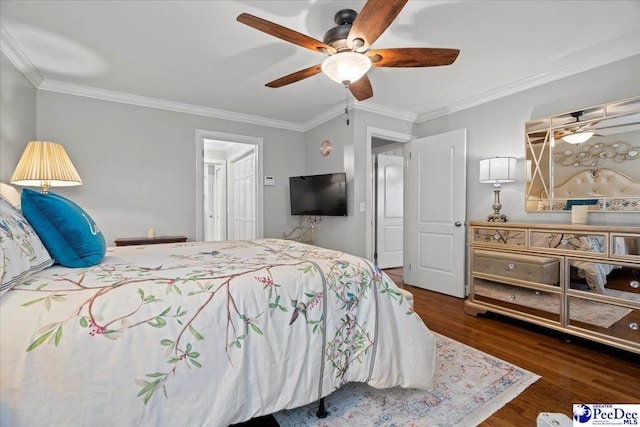 bedroom featuring wood finished floors, a ceiling fan, and crown molding