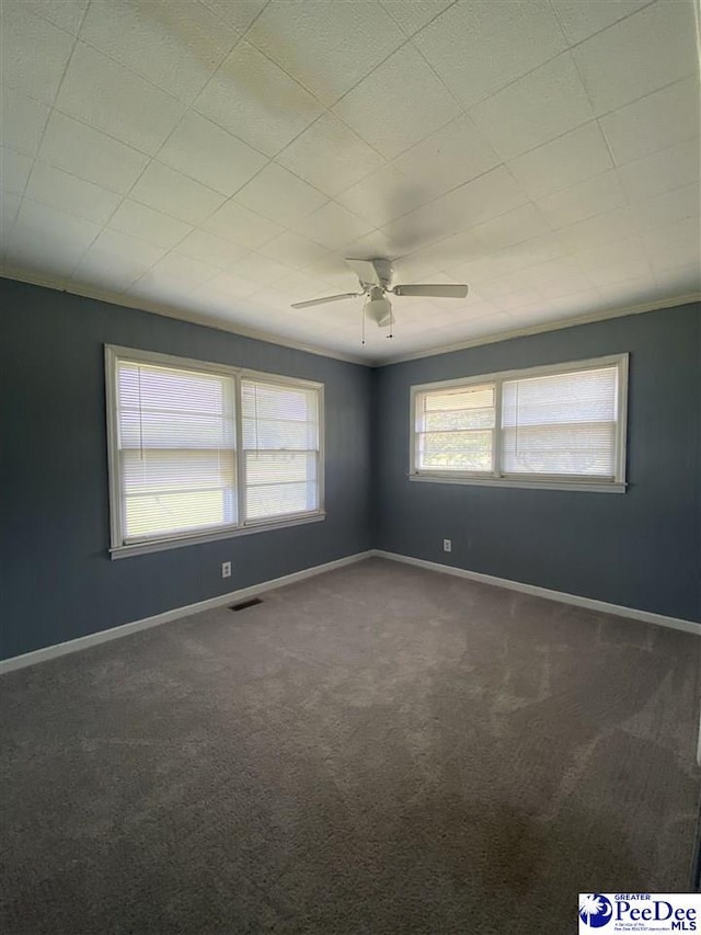2266 Mack Arthur Rd, Mullins, SC 29574 - unfurnished room featuring dark carpet, ceiling fan, and baseboards