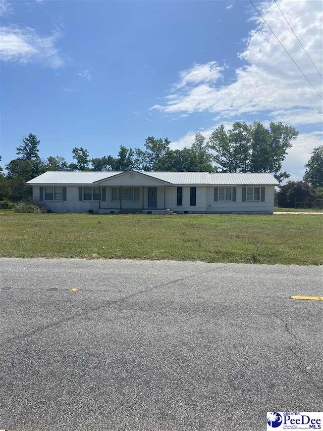 2266 Mack Arthur Rd, Mullins, SC 29574 - single story home featuring a front yard and metal roof