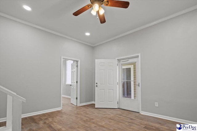 spare room featuring ornamental molding, wood finished floors, baseboards, ceiling fan, and recessed lighting