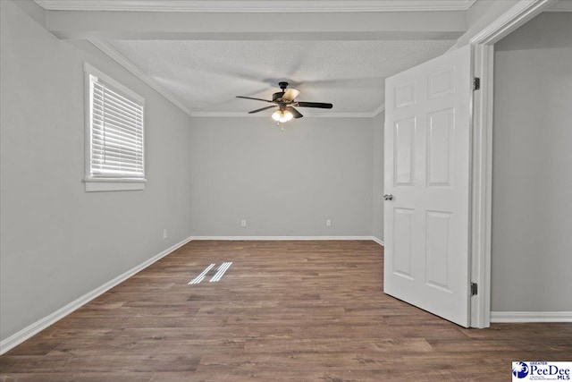 unfurnished room with wood finished floors, a textured ceiling, baseboards, ceiling fan, and ornamental molding