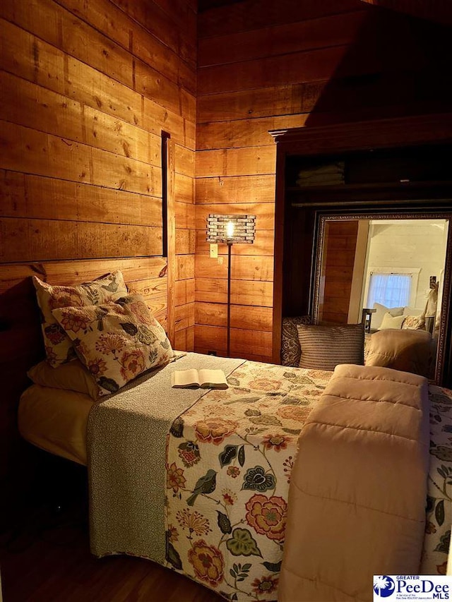 bedroom with wooden walls