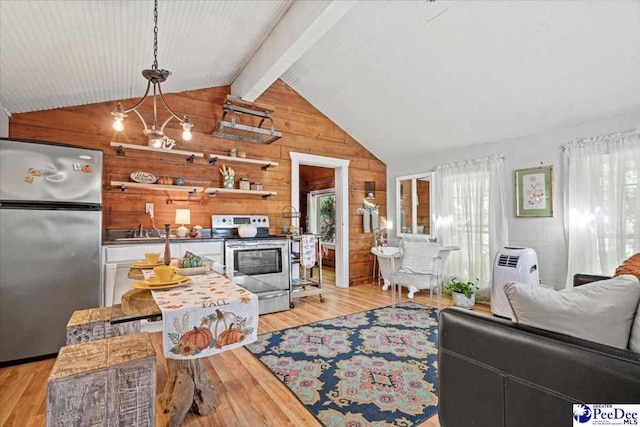 living room featuring sink, light hardwood / wood-style flooring, an inviting chandelier, lofted ceiling with beams, and wood walls