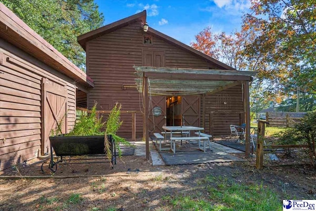 back of property with a patio area