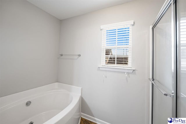 1224 Barn Owl Rd, Effingham, SC 29541 - full bath featuring a garden tub, a stall shower, and baseboards