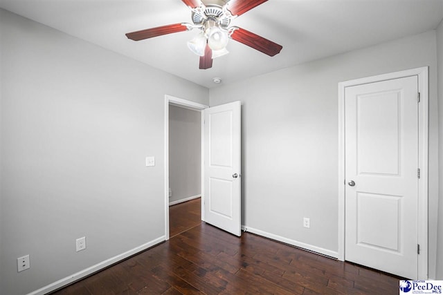 1224 Barn Owl Rd, Effingham, SC 29541 - unfurnished bedroom featuring wood finished floors, baseboards, and a ceiling fan