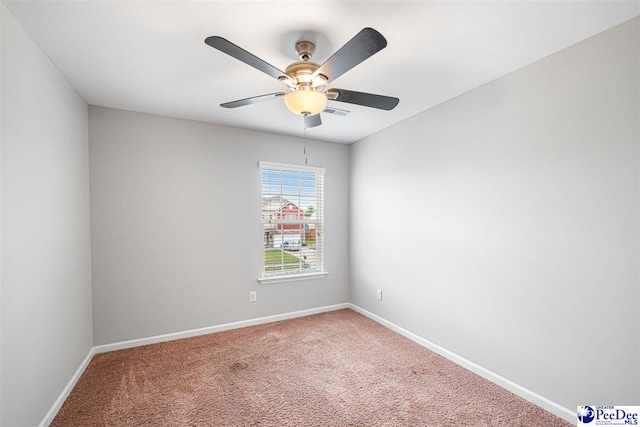 1224 Barn Owl Rd, Effingham, SC 29541 - spare room with a ceiling fan, baseboards, and carpet floors