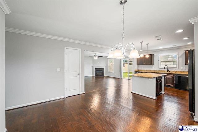 1224 Barn Owl Rd, Effingham, SC 29541 - kitchen featuring dishwasher, open floor plan, a center island, ornamental molding, and dark brown cabinetry