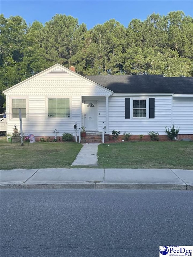 ranch-style house with a front yard