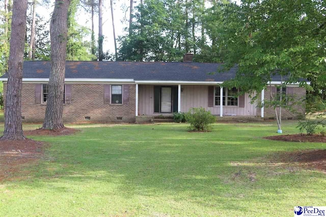 single story home with a chimney, brick siding, a front lawn, and crawl space