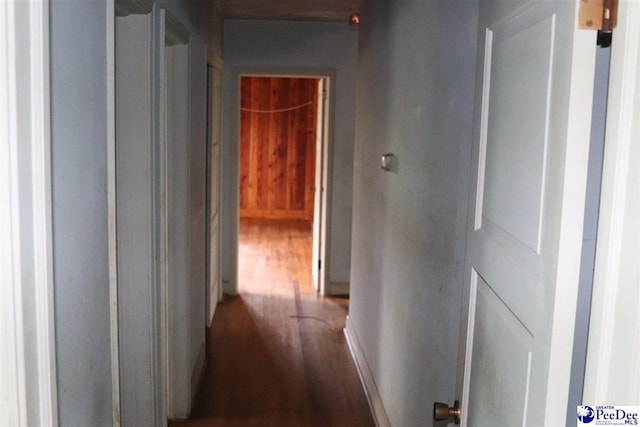 hall with wood finished floors
