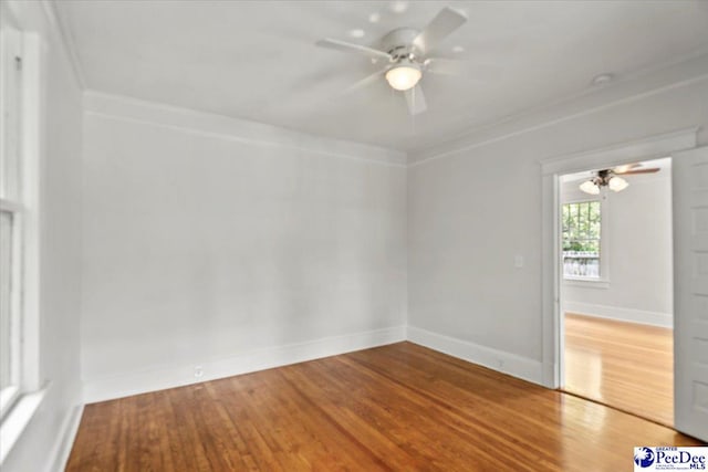 701 S Coit St, Florence, SC 29501 - spare room with ceiling fan, wood finished floors, and baseboards