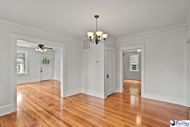 701 S Coit St, Florence, SC 29501 - unfurnished dining area featuring a chandelier, light wood-style floors, crown molding, baseboards, and ceiling fan