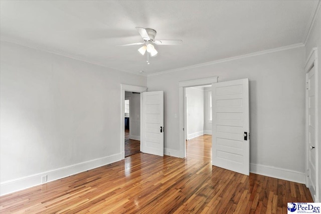 701 S Coit St, Florence, SC 29501 - unfurnished bedroom featuring wood finished floors, crown molding, baseboards, and ceiling fan