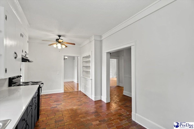 701 S Coit St, Florence, SC 29501 - kitchen featuring black range with electric stovetop, under cabinet range hood, ceiling fan, ornamental molding, and light countertops